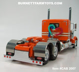 Item #CAB 2007 Orange Cream Black Outline Peterbilt 389 36-inch Flattop Sleeper - 1/64 Scale – DCP by First Gear