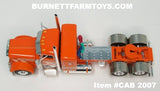 Item #CAB 2007 Orange Cream Black Outline Peterbilt 389 36-inch Flattop Sleeper - 1/64 Scale – DCP by First Gear