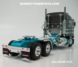Item #CAB 2123 Dark Gray Silver Turquoise Kenworth K100 COE Aerodyne Sleeper - 1/64 Scale – DCP by First Gear