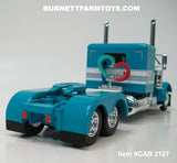 Item #CAB 2127 Turquoise White Stripe Silver Outline Peterbilt 379 48-inch Flattop Sleeper - 1/64 Scale – DCP by First Gear