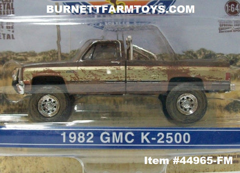 Item #44965-FM Brown Gold 1982 GMC K-2500 Fall Guy Stuntman Association Pickup Truck - Muddy Edition - 1/64 Scale - Greenlight