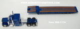 Item #60-1174 Western Distributing Blue Peterbilt 389 63-inch Flattop Sleeper with Blue Tri-Axle Talbert 5553TA Slide Axle Flatbed Trailer - 1/64 Scale - DCP