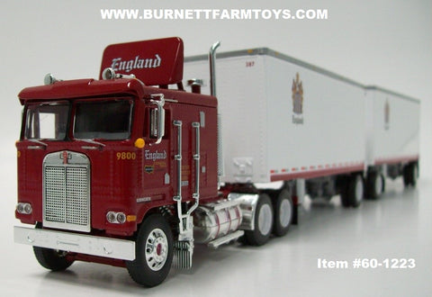 Item #60-1223 CR England Red Kenworth K100 COE Flattop Sleeper with Air Faring and White Silver Frame Single Axle Wabash 28-foot Double Pup Dry Goods Van Trailers and Single Axle Dolly - 1/64 Scale - DCP