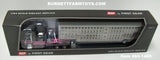 Item #60-1469 Black Pink Peterbilt 389 70-inch Mid Roof Sleeper with Silver Spread Axle Wilson Silver Star Livestock Trailer with Chrome End Caps - 1/64 Scale - DCP by First Gear