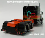 Item #CAB 1300 Black Orange Yellow Stripe Long Frame Peterbilt 389 70-inch Mid Roof Sleeper - 1/64 Scale - DCP